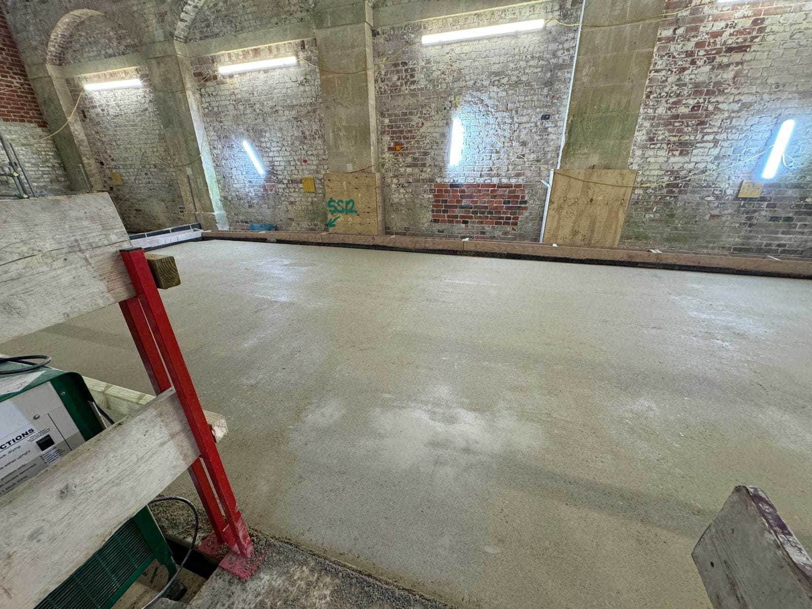 Finished breathable limecrete floor in a restored heritage brick building
